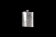 An engraved hip flask